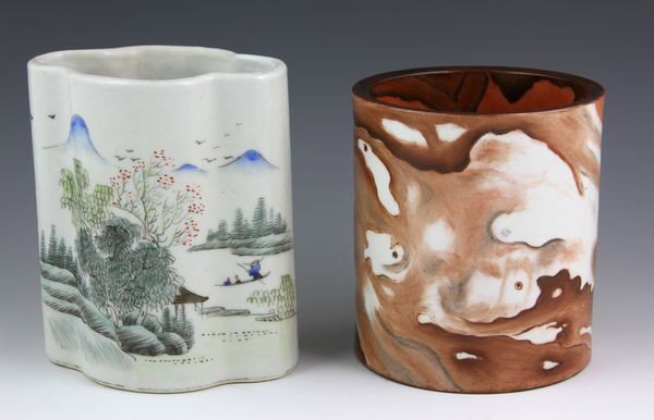 Two Chinese 20th C. Brush Pots: Two Brush Pots, China, 20th century, one famille verte painted with a mountainous landscape on one side and calligraphy on the reverse, one painted with a wave or rock-like design and calligraphy, bot