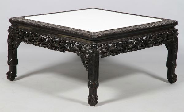 Chinese 19th C. Teak Table: Ebonized Teak Table, China, 19th century, the low table with a carved apron, legs, and top all in an ornate floral and foliate scroll design, white marble top, 17" high x 31 1/2" wide x 31 1/2" deep.