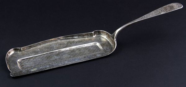 Victorian Silver Crumber: Victorian silver crumber tray with border of bright cut flowers and scrolls, engraved flat rounded handle reads: "A.B. Warner 11oz." 13 5/8"l.