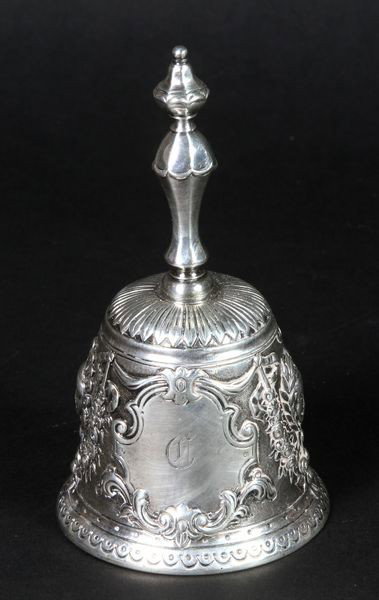 Sterling Bell: Sterling bell, hallmarked for London, 1915, 10.5 troy oz., ornate design with woman's faces and floral chain, monogrammed "C". Good condition.