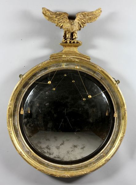 1820 Federal Convex Mirror: Federal convex mirror, circa 1820, carved and gilt wood frame and eagle finial, 45"h x 31" dia. (overall). Minor gilt wear, very small piece broken off at tip of one wing.