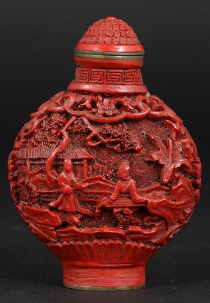 19th/20th C. Chinese Cinnabar Snuff Bottle: 19th/20th century Chinese cinnabar snuff bottle carved with landscape scenes with figures, brass base with mark