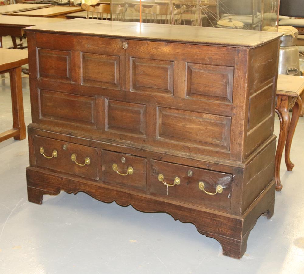 18th Century English Paneled Chest: 18th century English paneled chest, lift-top, three-drawer, bracket foot, pegged construction, 44 1/4" H x 55 1/2" W x 22" D. Age crack on lid, otherwise good condition. Purchased by Mr. Athanas at MG