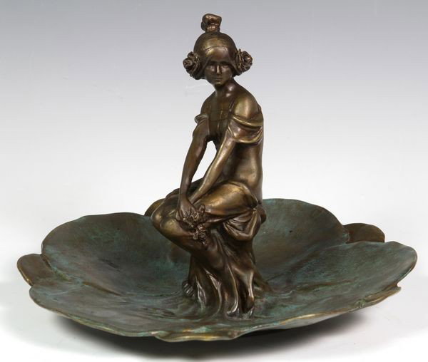 Art Nouveau Bronze Figurine: After Raoul Larche (French, 1860-1912), Art Nouveau figure of a woman with flowers, bronze, signed on base, 7 1/3" H x 10 1/4" D. Undamaged.