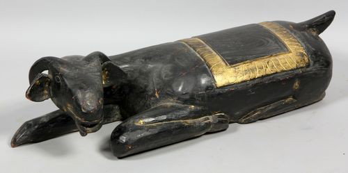 Statue of a Goat: 19th Century statue of a recumbant goat, ebonized and gilt carved wood, 33" x 11" x 9".