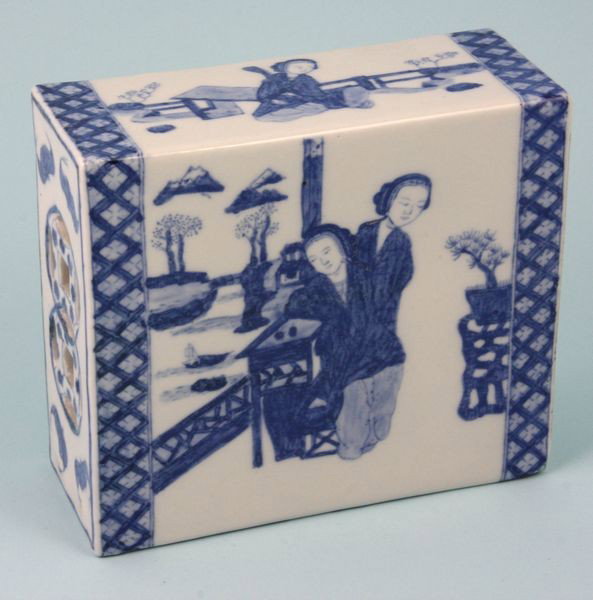 Blue and White Porcelain Pillow: Blue and White Porcelain Pillow, China, 19th century, decorated with scenes of women in courtyards, bats on both ends, and pierced Chinese coin motif, 2 1/4" high x 5 3/4" wide x 2 1/4" deep.