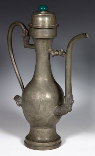 Chinese 19th C. Pewter Wine Pot: Pewter Wine Pot, China, 19th century, the bottle form body incised with flowers and figures, the spout and handle in a dragon head design, with a Peking glass knob on the lid, marked on base, 11 1/4" 