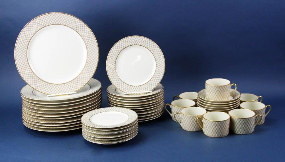 Fitz and Floyd Dynasty Pattern Dinner Service: Fitz and Floyd "Dynasty" pattern gold and bone dinner service, to include: (12) dinner plates; (12) salad plates; (8) cups and saucers.