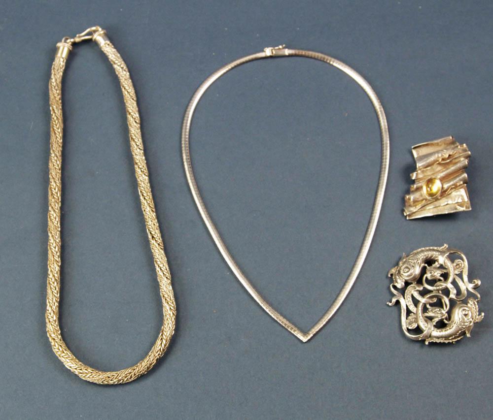 Sterling Jewelry, Necklaces and Brooches: Sterling jewelry, to include: necklace, 16 1/2" L; necklace, 17 1/2" L; brooch with yellow stone and 14k yellow gold trim, 1 3/4" W; brooch marked "Cini", 2" W. Provenance: Santa Barbara, California c