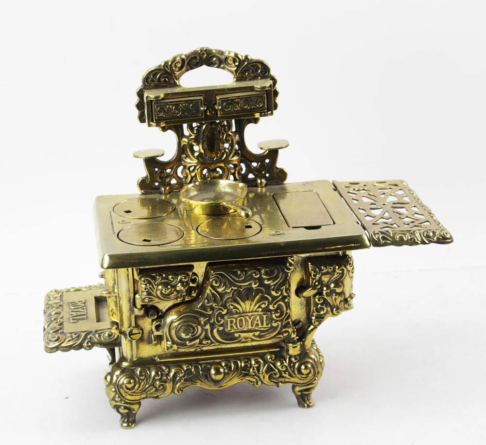 Antique Child or Salesman Sample Brass Stove: Antique child's or salesman's sample brass stove, Royal/Kenton brand, 12" H x 14" W x 6 1/2" D. Provenance: Palm Beach, Florida estate.