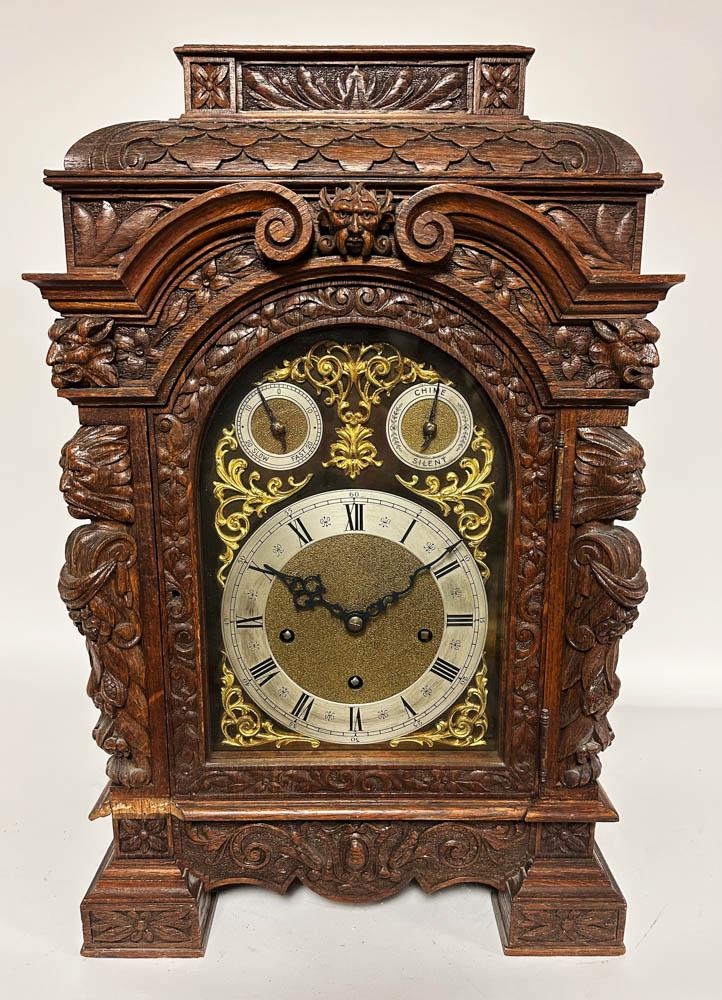 19thC Carved Oak Mantel Clock: 19th century carved oak mantel clock having chimes, keys, case possibly carved by Horner Brothers, 23" x 14" x 10". Provenance: "Rock Edge" Prides Crossing, Beverly, MA.