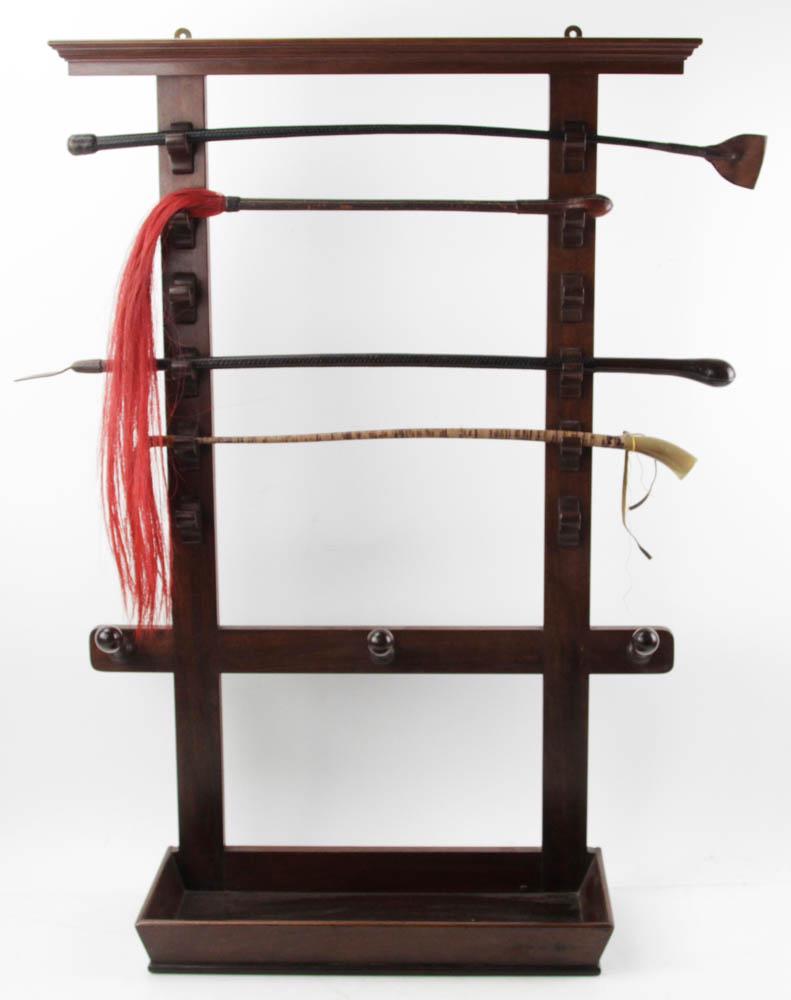 Early 20thC Mahogany Whip Rack with Whips: Early 20th century mahogany whip rack with (4) leather whips, 37 1/2" x 26". Provenance: Peabody, Massachusetts collection.