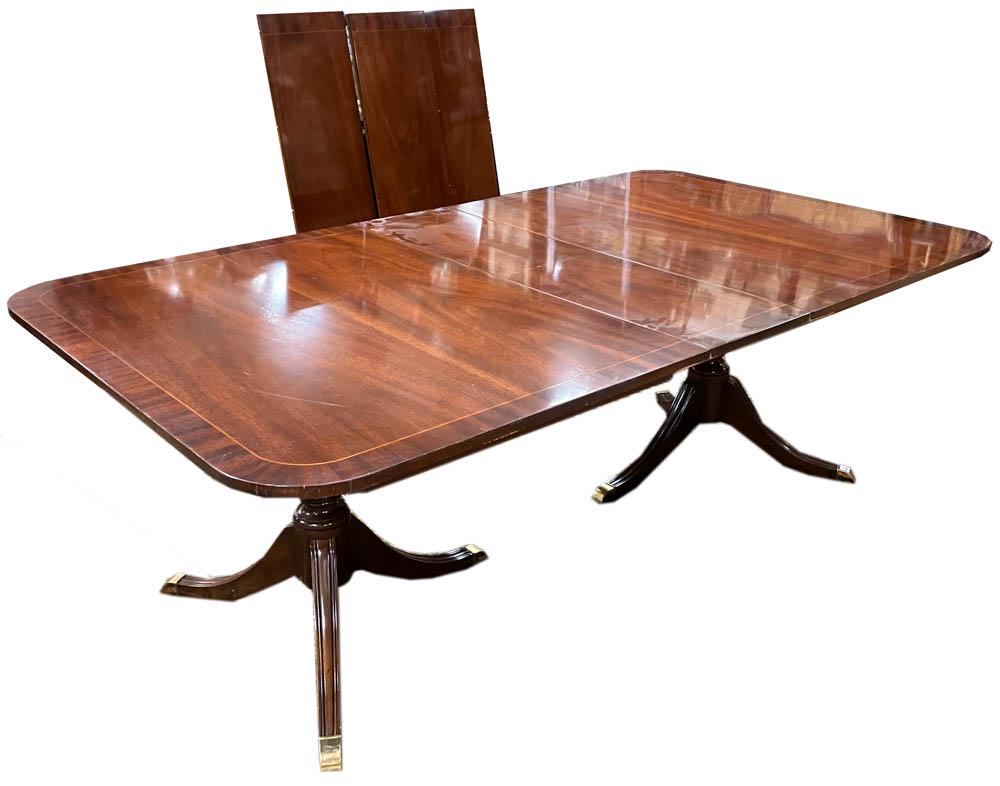 Kindel Custom Mahogany Dining Table: Kindel custom mahogany dining table, includes pads and (4) 12" leaves. 28" H x 68" W x 46" D. Provenance: Palm Beach, Florida estate.