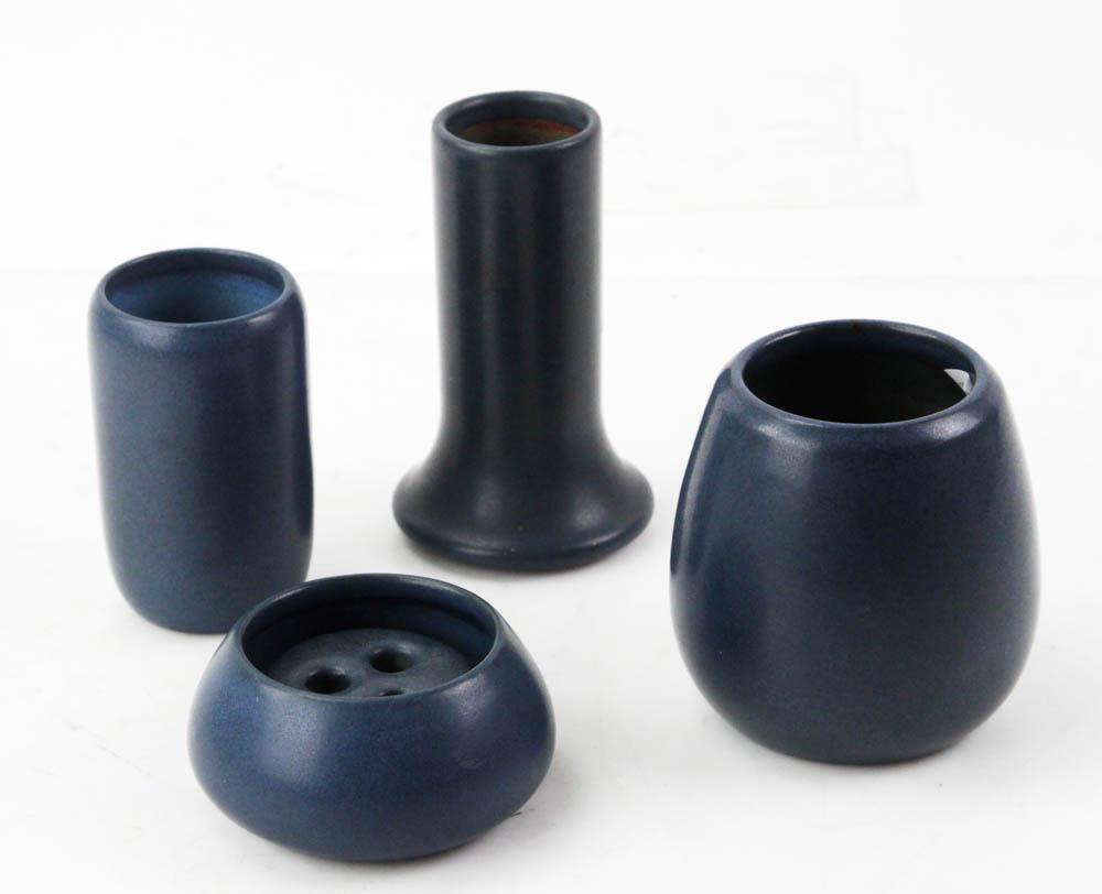 Marblehead Pottery Vases with Flower Frog: Marblehead Pottery group of vases, dark blue, sizes 3 1/2" x 3 1/2"; 3 1/2" x 2 1/4"; 3 1/2" x 2 1/4"; 1 3/4" x 3 1/4". With flower frog. (5) pieces total. Provenance: Montecito, California collection