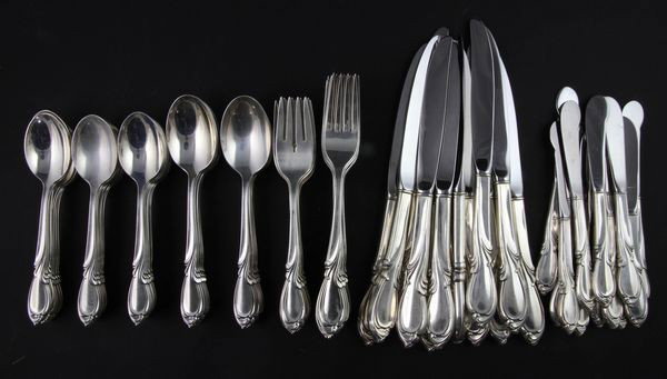 Sterling Flatware Service for 12: International sterling flatware service for 12 with rhapsody pattern, 12 each of dinner forks, luncheon forks, table spoons, dinner knives, butter spreaders, and 24 teaspoons, 84 pieces total, 92.3 tr