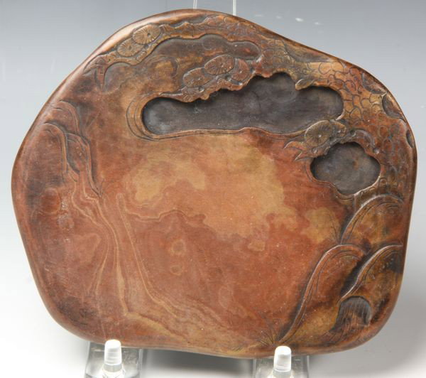 Chinese 18th C. Hongsi Inkstone: Hongsi inkstone, China, 18th century, carved with pine trees over mountain peaks, bottom bearing the carver's inscription, 5 1/2"l.