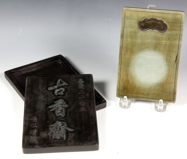 Chinese 19th C. Songhua Inkstone: Songhua rectangular inkstone, China, 19th century, together with box of carved Duan stone incised with the studio name "Gu Xiang Zhai" and signature, dated 24th year of Emperor Jiaqing, 6 2/3"l.