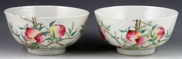 Pair of Chinese 20th C. Famille Rose Bowls: Pair of famille rose bowls, China, early 20th century, exterior decorated with peaches, lingzhi and blossoms, interior painted with bats and peaches, with six-character mark on base, 2 1/4"h x 4 3/4"w