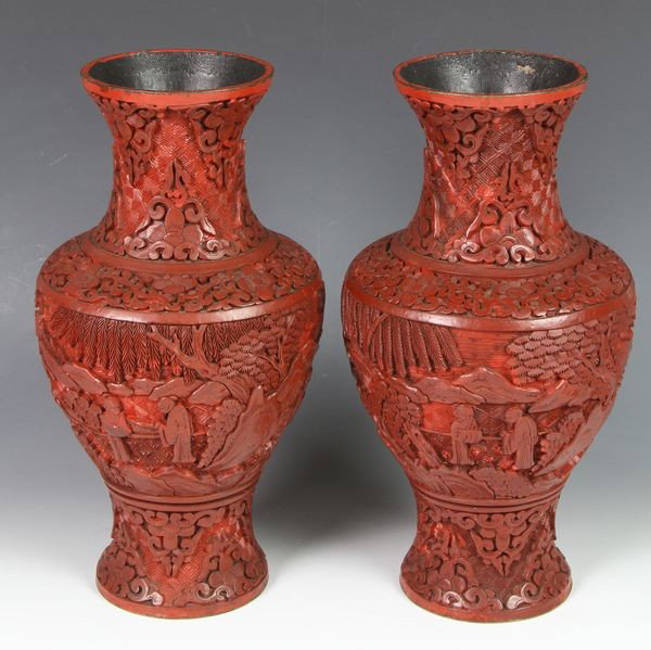 Pair of Chinese 19th C. Cinnabar Vases: Pair of cinnabar vases, China, 19th century, the bulbous form carved with figures in a landscape, with scrolling floral motifs over leiwen patterned ground, 10"h.