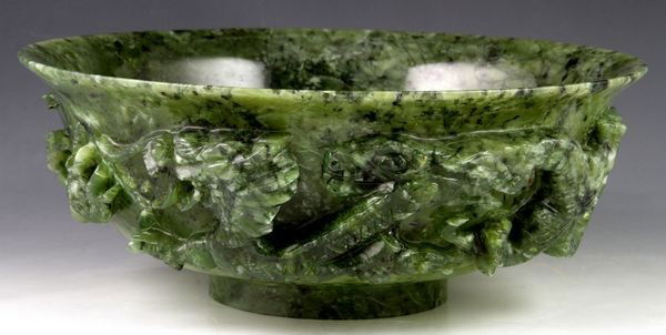 20th C. Carved Jade Bowl: Spinach jade bowl, early 20th century, carved in deep relief with dragons, 3 1/8"h x 8"dia.