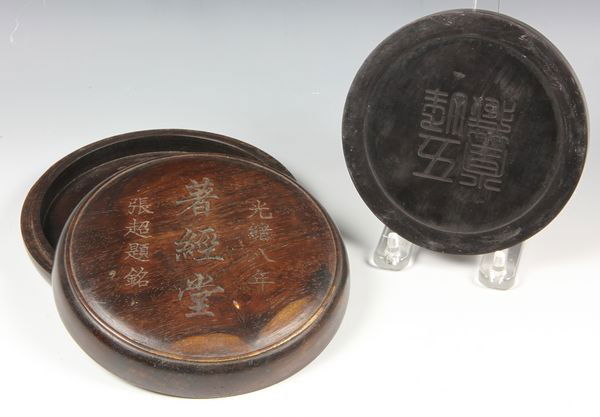 Chinese 19th C. Duan Inkstone: Duan inkstone, China, 19th century, the circular form incised with "wu feng tang cang" on the bottom, together with wood box marked with studio name "Zhu Jin Tang" and signature, dated 8th year of Emp
