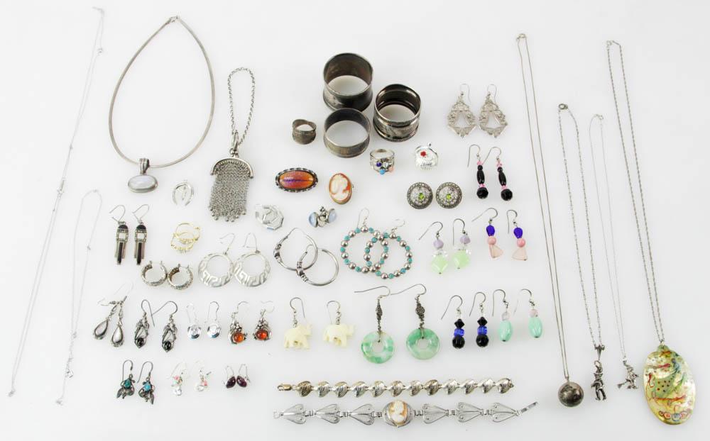 Collection of Sterling Jewelry, Napkin Rings, etc: Collection of sterling jewelry, napkin rings, etc., jade, amethyst, amber, miniature Nantucket basket. Approximately 10.3 troy oz TW. Provenance: Beverly, Massachusetts collection. PLEASE NOTE: paymen