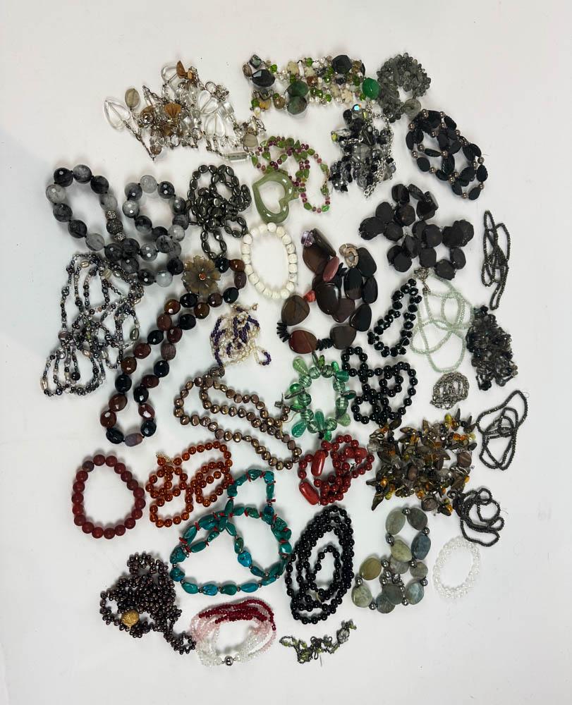 Collection of Bracelets and Necklaces: Collection of bracelets and necklaces set with natural stones, to include amber (with 14k clasp), pearls, amethyst, turquoise, onyx, Murano glass, jade, etc., some sterling. Provenance: Chestnut Hill,