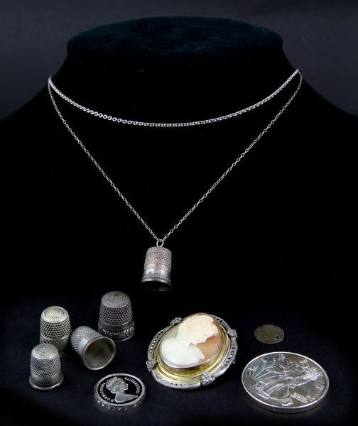 Miscellaneous Sterling Group: Miscellaneous sterling lot to include: Victorian shell cameo brooch/pendant, .999 fine one troy oz liberty silver trade unit, Queen Elizabeth II 1984 one pound proof coin, American 1852 silver 3 cent 