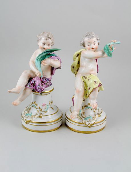2 19th C. Samson Porcelain Figurines: Two (2) Samson figurines, porcelain, of cherubs, crossed swords mark, figures sitting on molded boxes, 9"h.