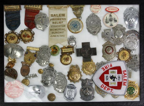 Lot of Fire Dept. Badges: Lot of Fire Department Badges of Massachusetts towns to include: Salem, Danvers, Marblehead, etc with dates to 1918 along with uniform buttons.