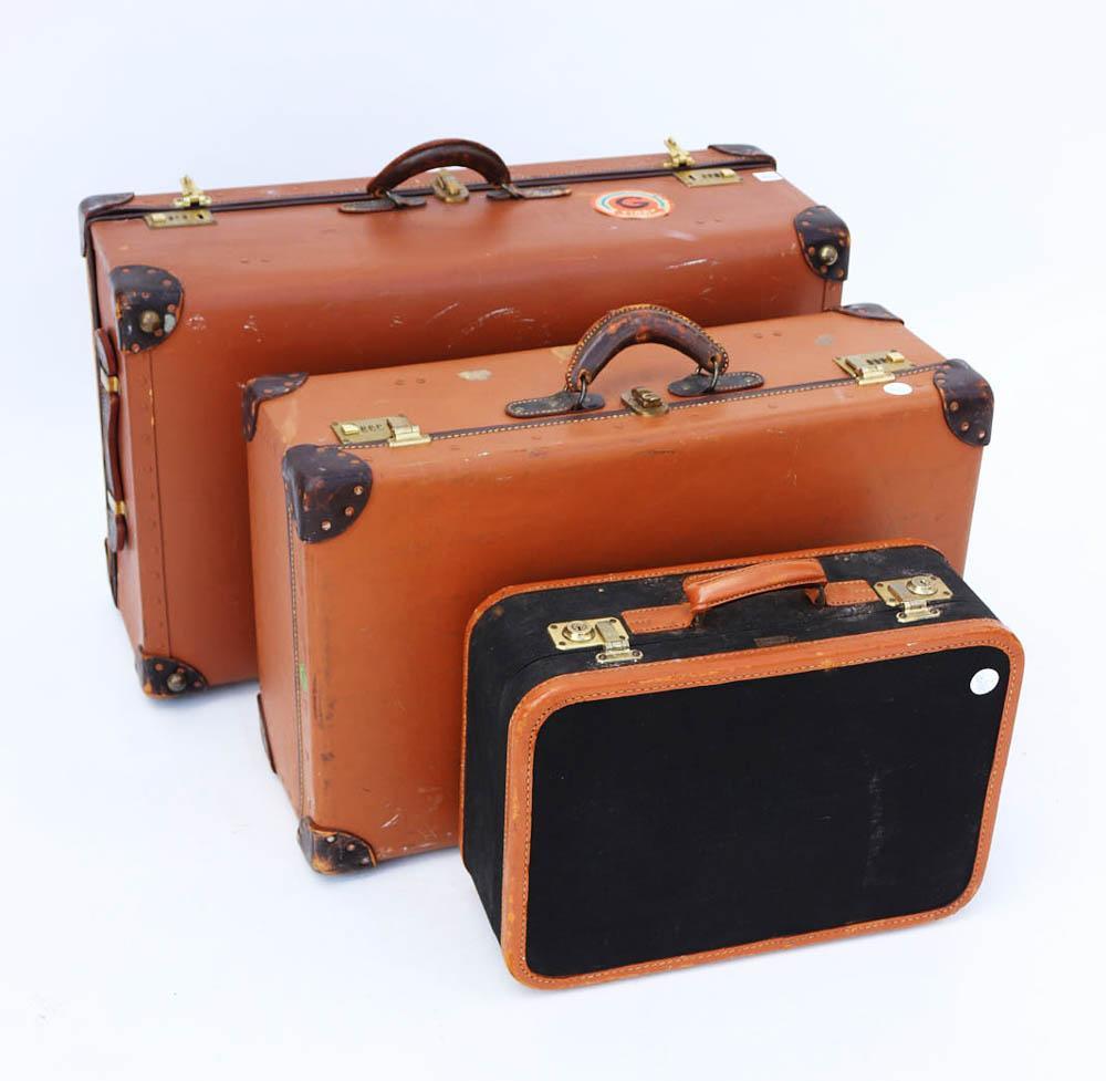 Assorted Old Suitcases: Assorted old suitcases.