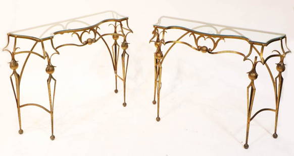 Italian Glass-Top Tables, After Gilbert Poillerat: Italian gold-painted wrought iron tables with glass tops, after Gilbert Poillerat (French, 1908-1988), labeled Orentia Italy, 30" H x 41" W x 14" D. Provenance: Palm Beach, Florida estate.