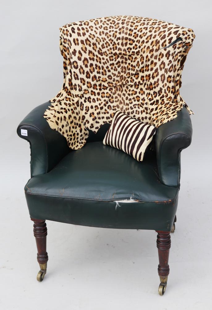 Late 19thC English Green Leather Armchair: Late 19th century English green leather armchair having mahogany legs and leopard hide attached, 36" H x 23" W x 26" D. Provenance: a Palm Beach, Florida estate.