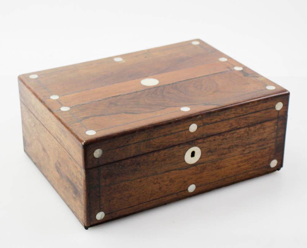 19thC English Rosewood Desk: 19th century English rosewood desk having a hand-stitched poem inside and mother-of-pearl inlay, 5" x 12" x 9". Provenance: Palm Beach, Florida estate.
