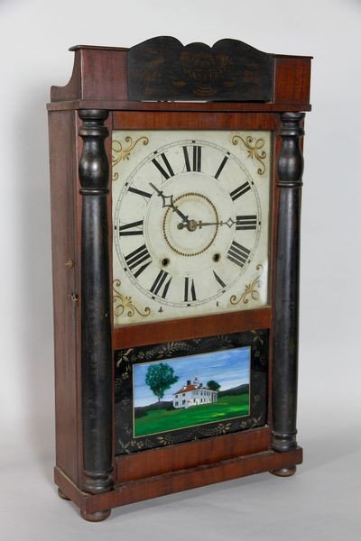 Eli Terry Pillar and Scroll Mantle Clock: Eli Terry pillar and scroll mantle clock with reverse painted scene of a house on door, wooden works, wooden face, traces of gilt decoration still visible on pillars and crest, 27 1/4"h x 15"w x 5 1/2