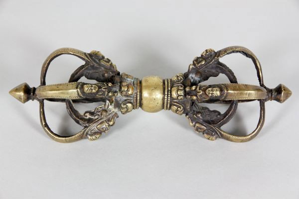 Cast Bronze Dorje: Dorje having looped ends with small figures and scrolled leaves, cast bronze, 10 3/4"l.