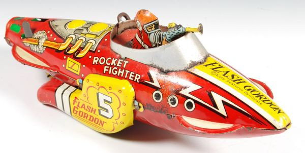 Marx Flash Gordon Rocket Fighter: Flash Gordon Rocket Fighter, by Marx, 5" x 12" x 4"d. In working order, paint loss.