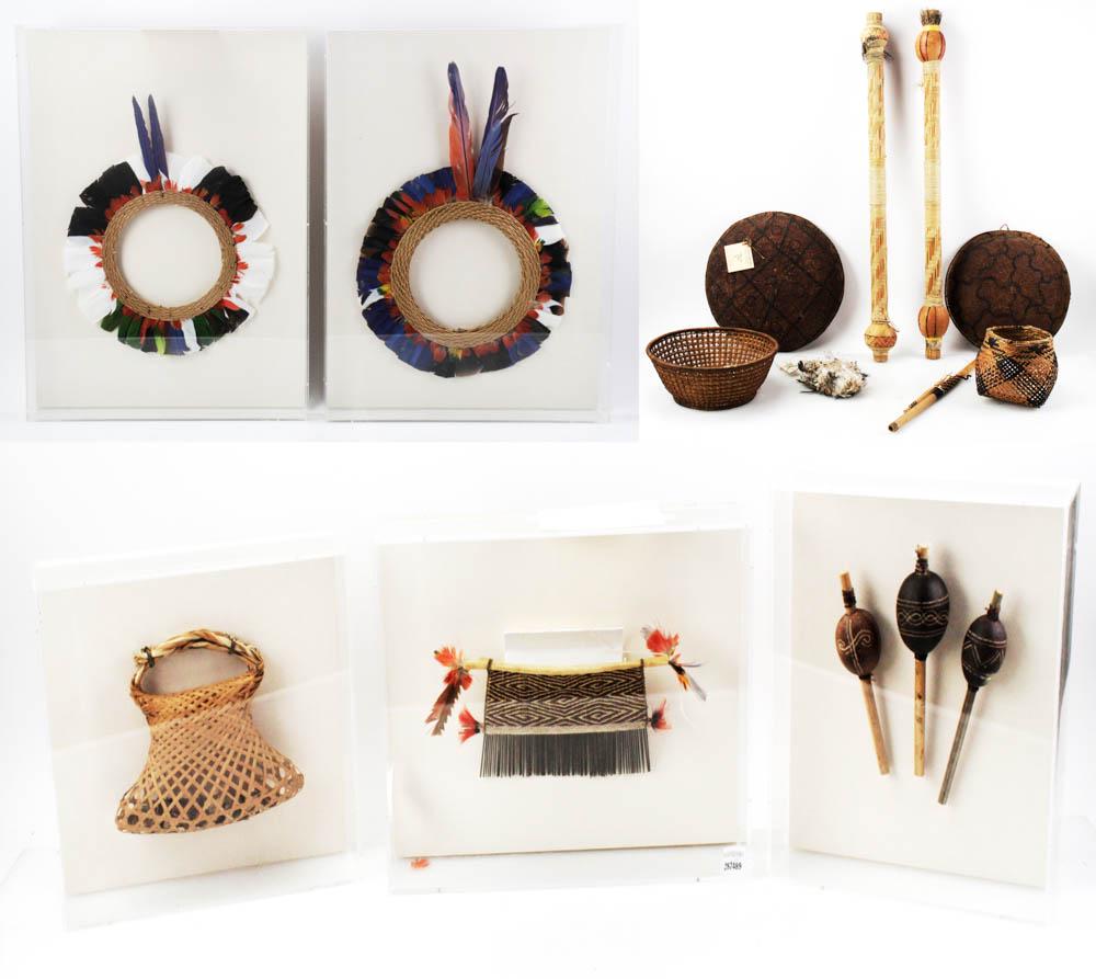 Amazonian Collection From Brazil: Amazonian collection from Brazil, feather bag and blow gun, four baskets, weaving, three rattles, rattle basket, two feather head dresses, etc. Provenance: Purchased by Don Howard of Marblehead, Massa