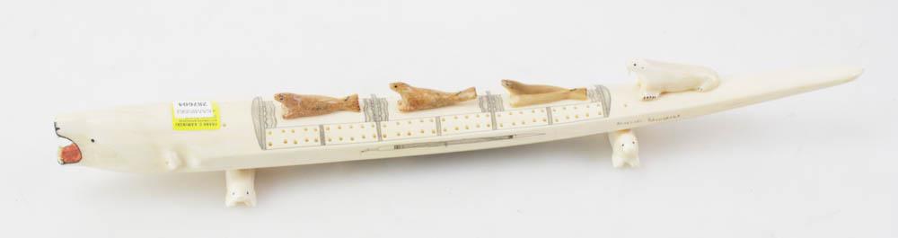Aloysius Pikonganna, Walrus Tusk Cribbage Board: Aloysius Pikonganna (1906-1986, Nome, Alaska master carver), walrus tusk cribbage board, polar bear head with red ochre finish, one walrus and three seals sitting on top of board, whole resting on two