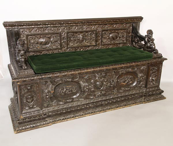 Antique Italian Carved Bench: Antique Italian, ornately carved bench, figure head arms, coat of arms crest, lift top seat with storage below, 37"h x 66"w x 21"d.