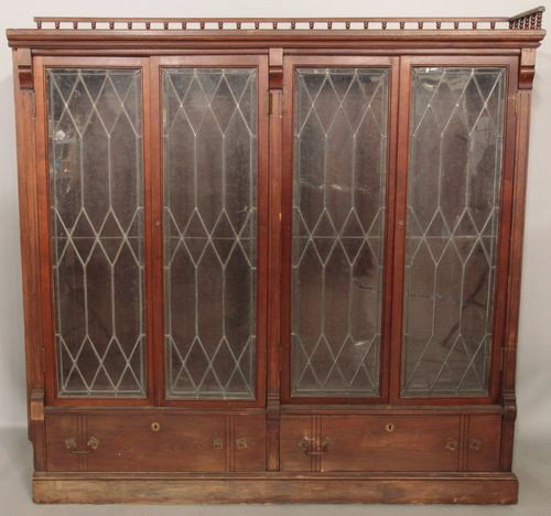 Pair of Mahogany Bookcases: Pair of bookcases, mahogany, leaded glass doors, circa 1900, 66 1/4"h x 67"w x 12 3/4"d. Some surface wear.