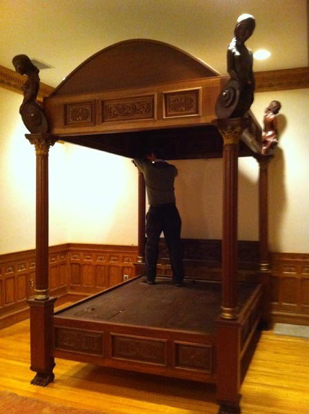 Carved Mahogany Canopy Bed: Fine custom carved mahogany canopy bed with fluted columns, paw feet and four composition female corner finials, approximately 9'6"h x 72"w x 94"l (post to post outside), queen size.