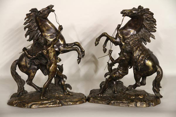 Pair of Bronze Marley Horses: Pair of 19th century bronze Marley horses with stable hands after Coustou, 19"h x 7"w x 14 1/2"d. Reigns broken.