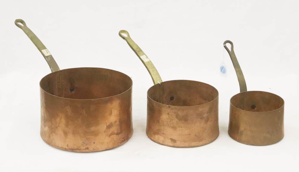 Antique Copper Pots: Antique copper pots, graduated set of three (3), brass handles, largest 6" H x 10" diameter. Provenance: The Anthony Athanas Collection, from one of his celebrated restaurants.