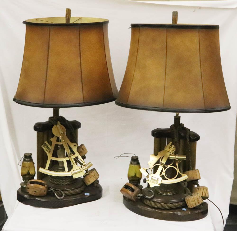Pair of Nautical Themed Lamps: Pair of nautical-themed lamps with brass sextant, lantern, pullies, etc., parchment shades, 25" H (to top of socket) x 16 1/2" W x 13 1/2" D. Provenance: The Anthony Athanas Collection, from one of hi
