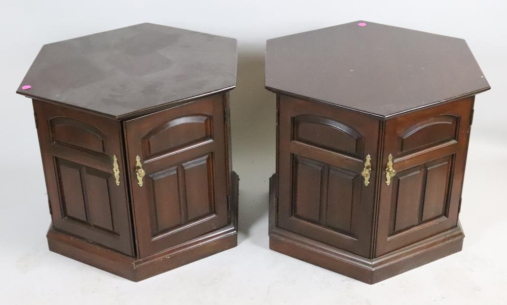 Pair of Mahogany Hexagon Shaped End Tables: Pair of mahogany hexagon-shaped end tables with paneled double doors, 22" H x 28 1/4". Good condition with some surface scuffing. Provenance: These items were in Mr. Athanas's personal office.