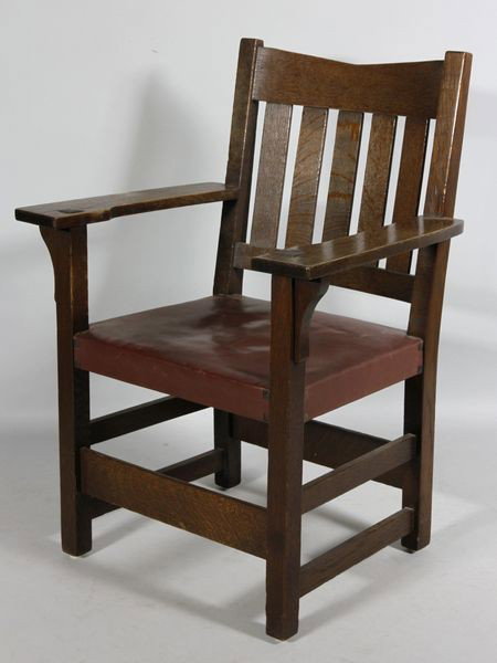 Stickley, V-Back Arm Chair: Gustav Stickley, V-back arm chair, oak, hard leather seat, signed, No. 311 1/2, 37"h, 18"h x 20"w x 19"d. Small split at top of back upright, original finish.
