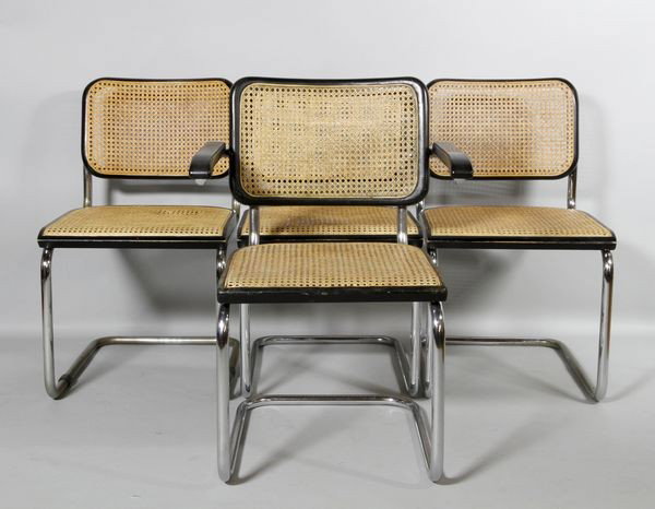 Group of 4 Thonet Chairs: Group of four Thonet chairs to include: three side chairs, one armchair, Marcel Breuer design, chrome steel tube frames, ebonized wood and cane seats, 31 1/2"h, 18"h x 18 1/8"w x 21 1/2"d (side chairs