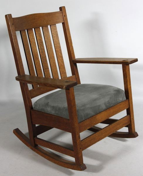L. & J.G. Stickley Oak Rocking Arm Chair: L. & J.G. Stickley, rocking arm chair, oak, reupholstered spring seat, signed with decal, 34"h x 26"w x 28 1/2"d.