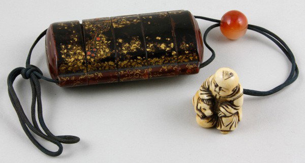 Japanese 19th C. Inro with Netsuke: Inro, Japan, 19th century, of gilt lacquer, with ivory netsuke carved in the form of a boy with dog, 3 1/4".